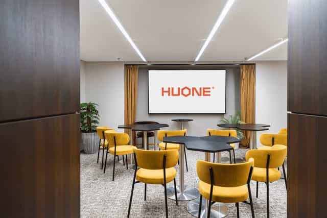 Modern Kaivopiha Lounge in HUONE Helsinki with yellow chairs for versatile meetings.
