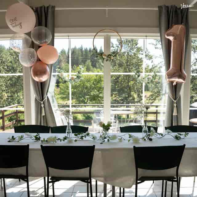 Elegant event space with floral decor, ideal for gatherings and celebrations.