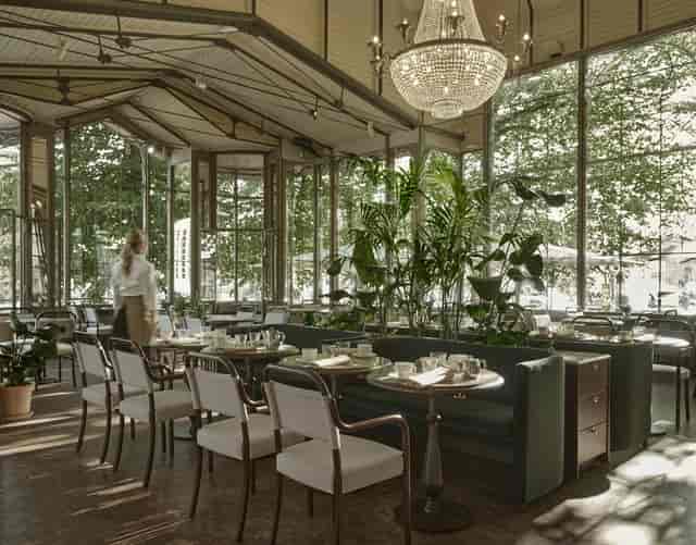 Elegant event space in Kappeli with natural light, perfect for meetings or gatherings.