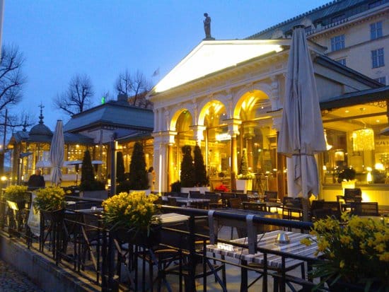 Outdoor dining at Kappeli with warm lighting for elegant evening events.