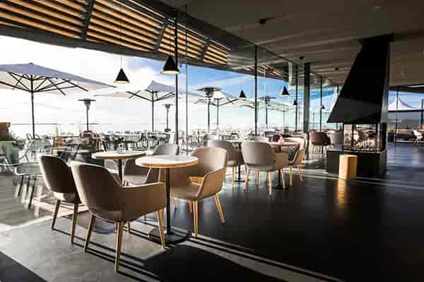 Modern event space at Löyly with natural light, perfect for gatherings and meetings.