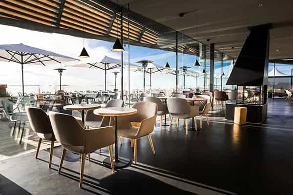 Modern event space at Löyly with natural light, perfect for gatherings and meetings.
