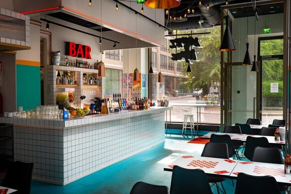 Modern bar in Kaiku with colorful decor for social events and networking.