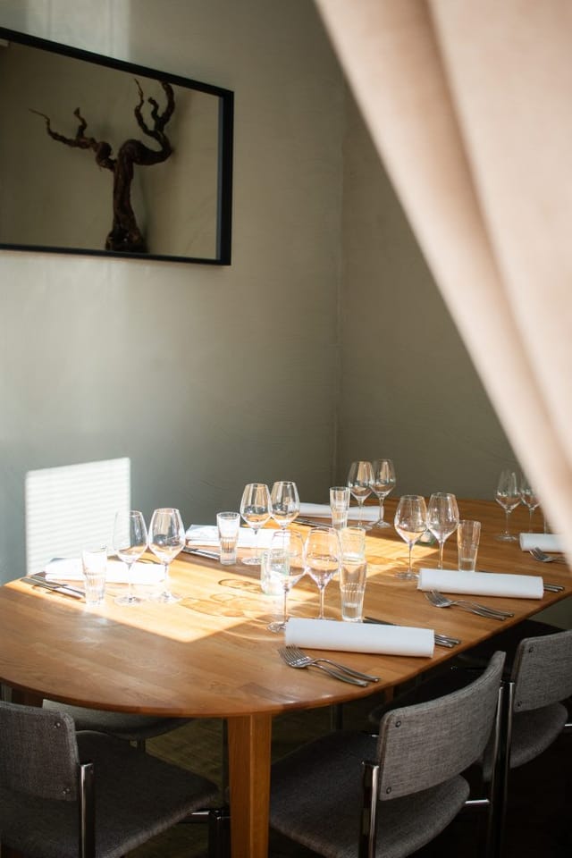 Elegant dining setting with glassware for intimate meetings and upscale events.