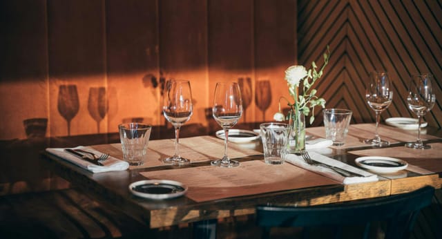 Elegant dining table setup at Pompier Espa for intimate events and corporate dinners.