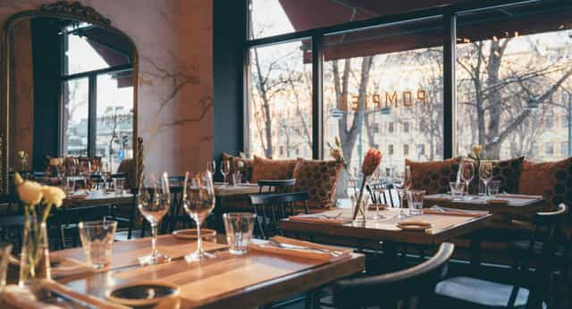 Stylish restaurant setup with elegant decor for corporate events and gatherings.