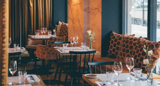 Stylish restaurant interior with elegant tables, ideal for private dinners and networking events.