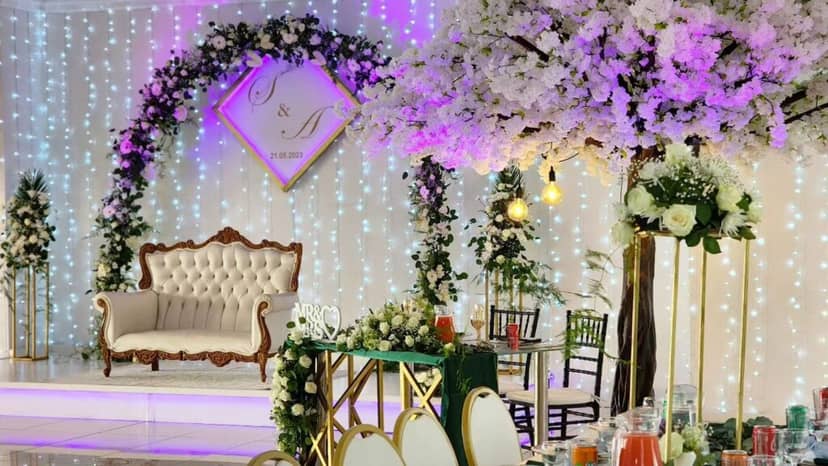 Elegant outdoor wedding venue with floral decor and romantic ambiance.