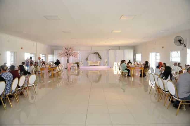 Spacious outdoor venue with elegant seating, perfect for weddings and corporate events.