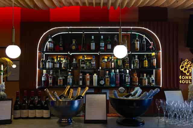 Cocktail bar at The Blue Room with elegant spirits display, perfect for events and networking.