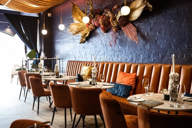 Elegant Blue Room event space with inviting decor for intimate gatherings and upscale dining.