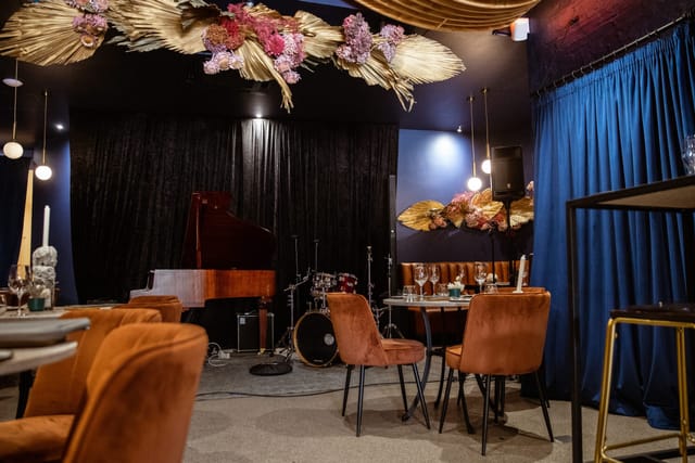 Chic Blue Room event space with elegant floral decor for upscale gatherings.