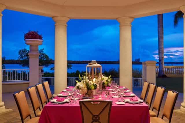 Elegant outdoor wedding venue at The Westin Cape Town with vibrant pink tablecloth.