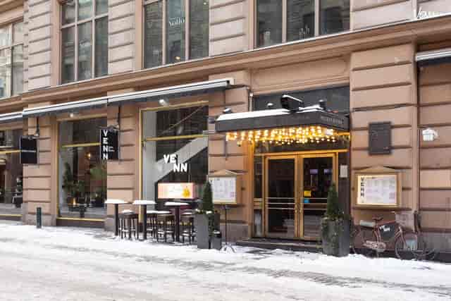 Stylish outdoor restaurant venue with warm lighting for intimate events and gatherings.