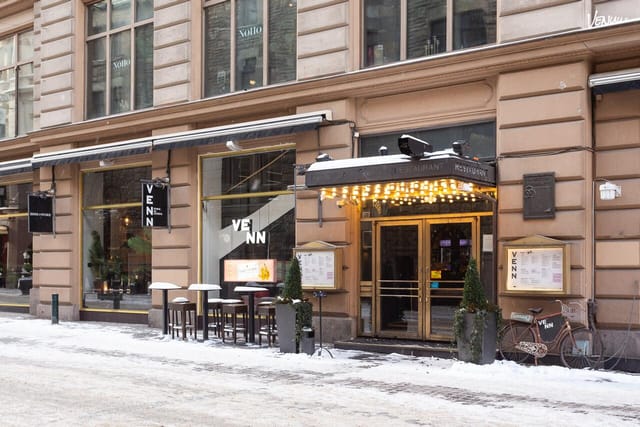Stylish outdoor restaurant venue with warm lighting for intimate events and gatherings.