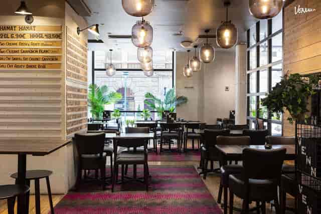 Modern event space with natural light, ideal for networking and intimate gatherings.