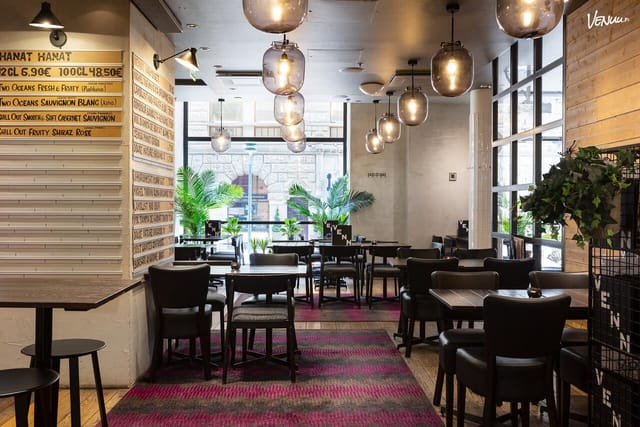 Modern event space with natural light, ideal for networking and intimate gatherings.