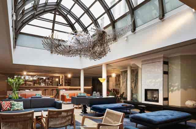 Elegant winter garden meeting space with skylight, perfect for networking events.