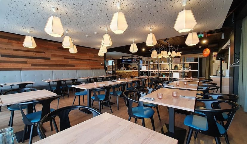 Modern dining space in Scandic Meilahti, ideal for corporate lunches and networking events.