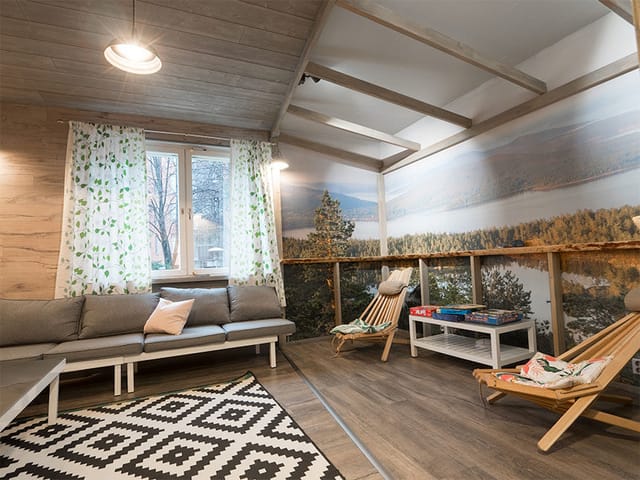 Cozy Eurohostel lounge with natural light, perfect for brainstorming and meetings.