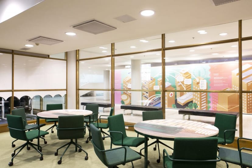 City Hall Lobby with large windows, vibrant decor for collaborative meetings and events.