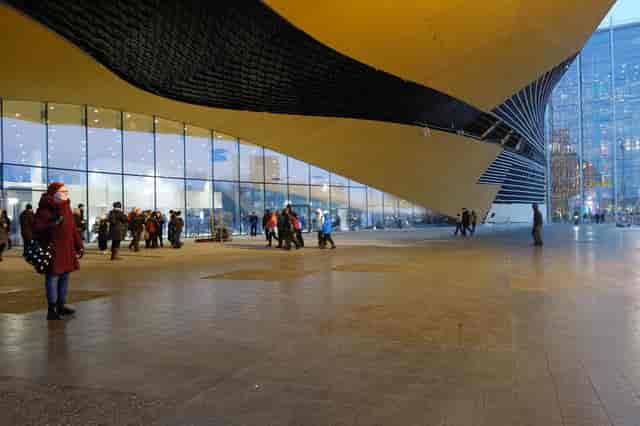 Aura in Oodi venue, striking glass architecture for events and exhibitions.