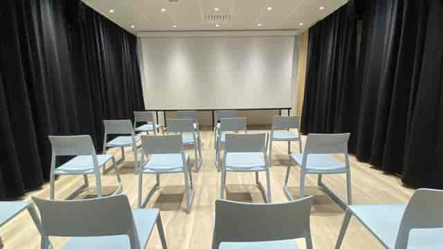 Aura in Oodi, light blue chairs arranged for a professional presentation.