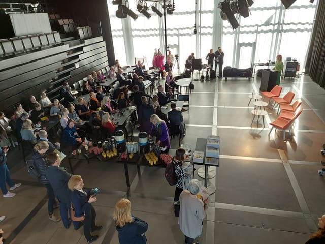 Maijansali Hall at Oodi, a professional event space for networking and presentations.