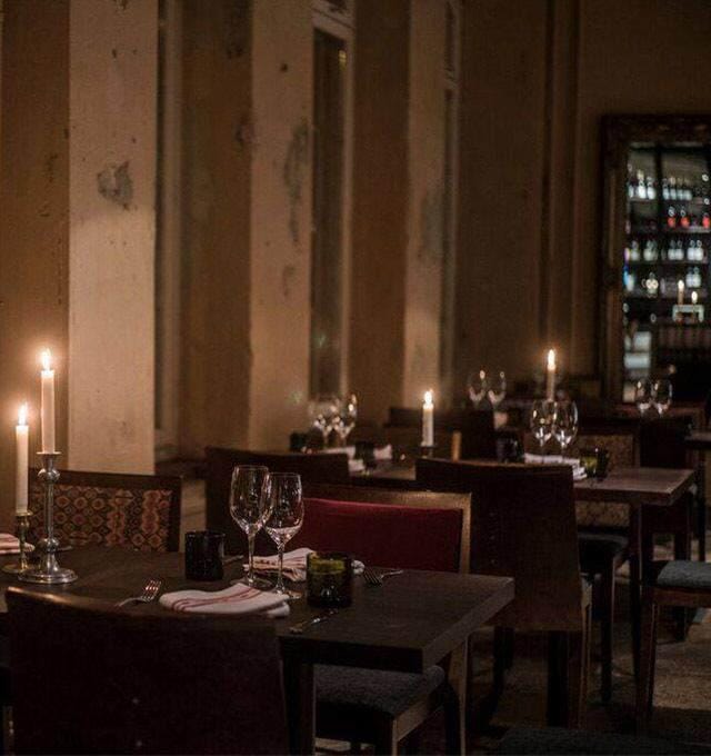 Elegant bistro dining with candlelight ambiance for intimate events and upscale gatherings.