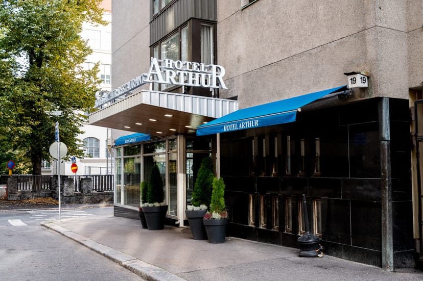 Beer garden at Hotel Arthur with blue awnings, ideal for corporate and social events.