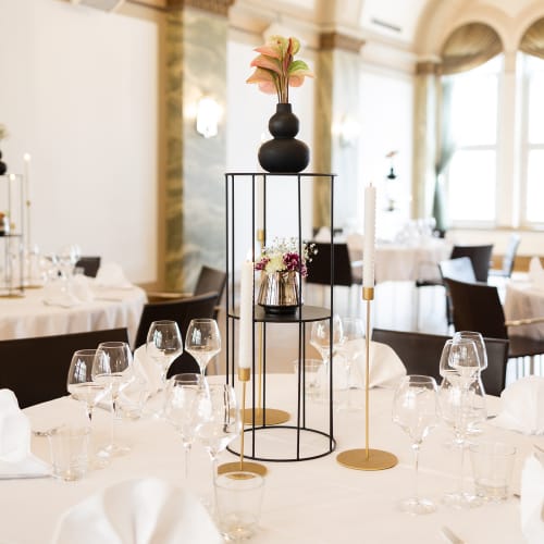Elegant Rake Ballroom dining setup at Klaus K Hotel for formal events and corporate gatherings.