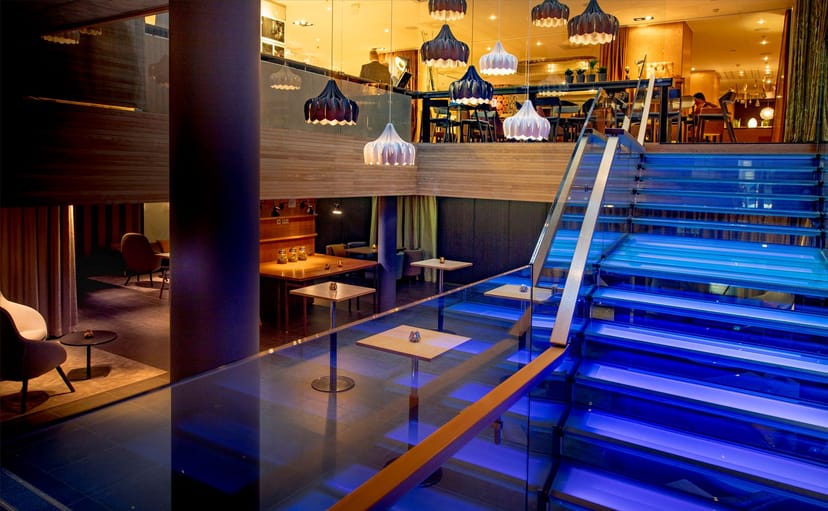 Stylish Klaus K Bar & Lounge with illuminated staircase, ideal for conferences and social events.