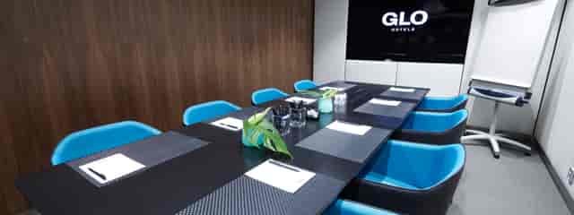 Modern conference room at GLO Hotels, ideal for corporate events and meetings.