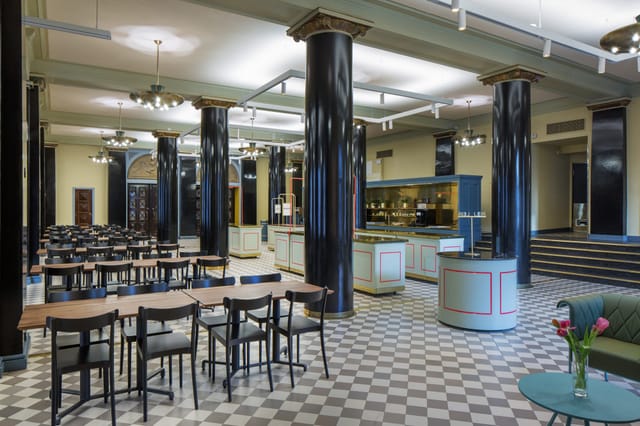 Elegant Restaurant Hall in Paasitorni, featuring high ceilings for events and gatherings.