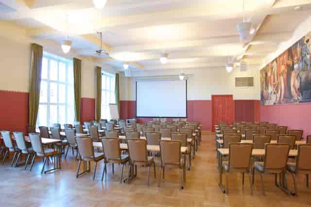 Spacious conference room in Paasitorni with natural light, ideal for workshops and meetings.