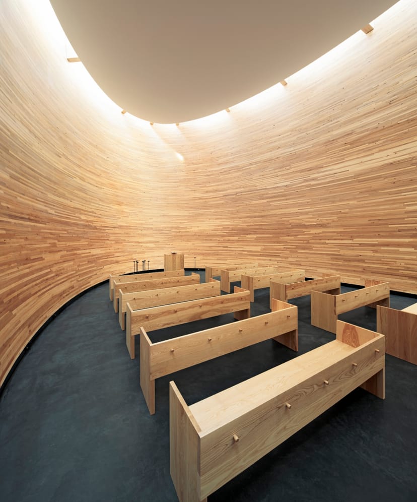 Kamppi Chapel's warm wood interior creates a cozy space for workshops and gatherings.