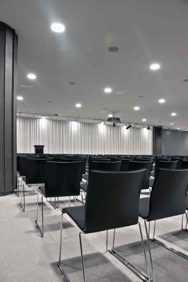 Elegant conference space at Finlandia Hall with sleek black chairs, ideal for presentations.