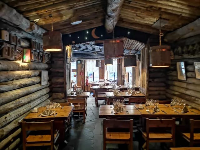 Rustic dining room with warm lighting for intimate gatherings or private events.
