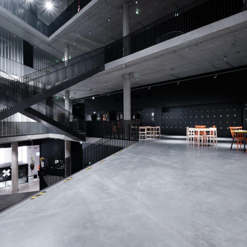 Kookos Auditorium 2 at Uniarts Helsinki: modern industrial event space with high ceilings.