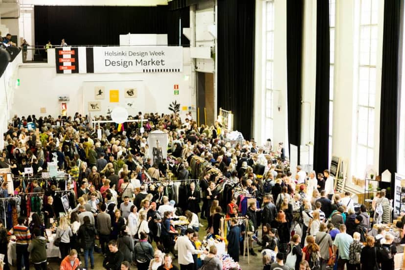 Vibrant scene at Little Market, Helsinki Design Week, with engaging vendor displays.