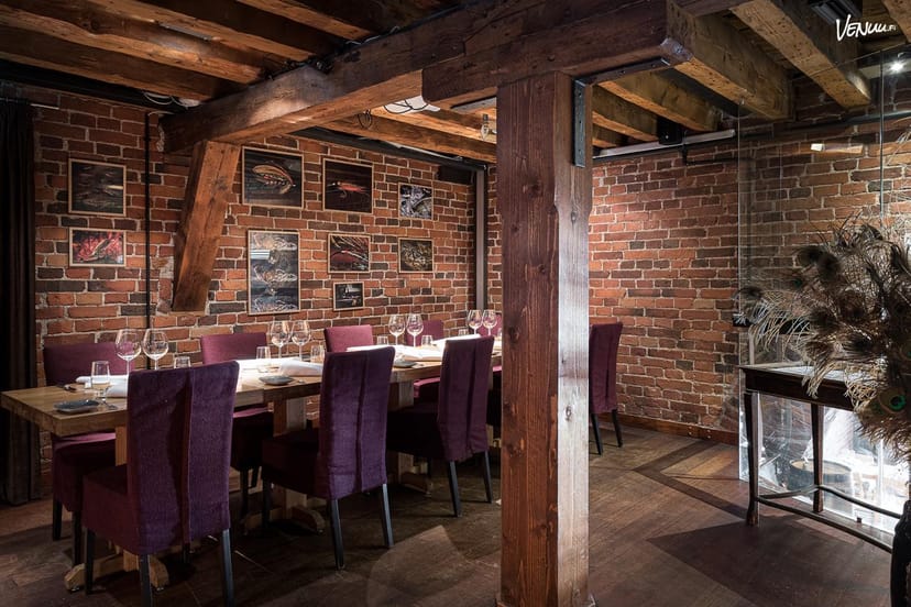 Cozy rustic dining space at Kokka-keittiö, perfect for intimate events and meetings.