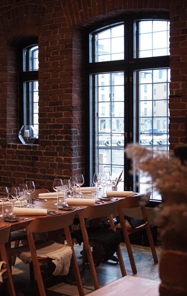 Stylish dining setup at Kokka-keittiö, perfect for networking dinners and celebrations.