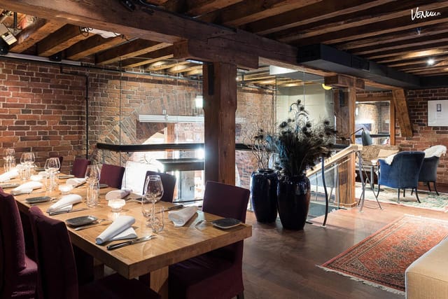Häät at Ravintola Nokka: elegant dining space with rustic beams for upscale events.