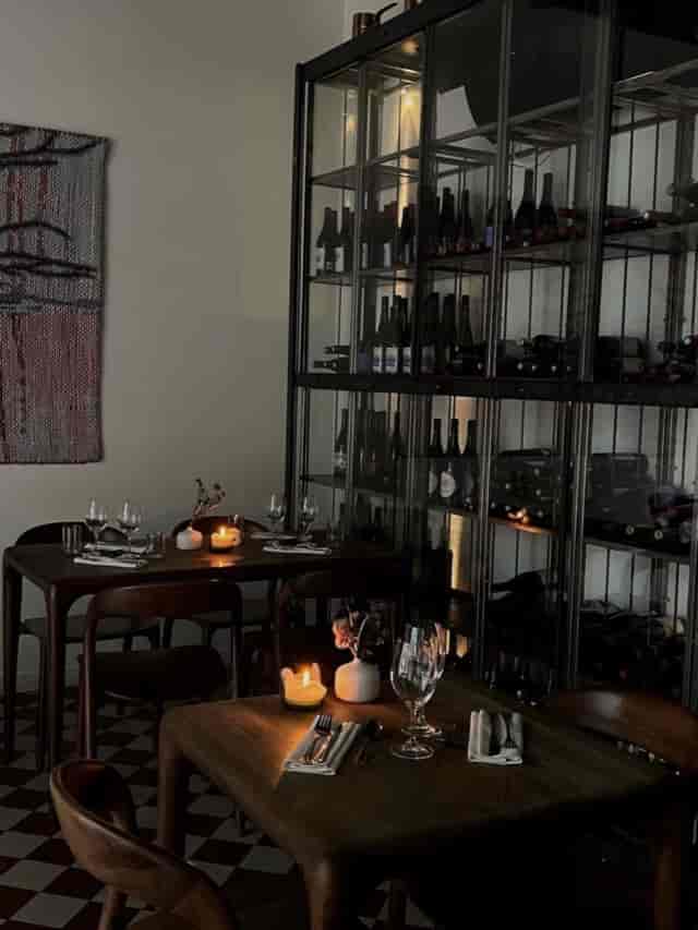 Intimate restaurant table setup with cozy lighting for private events and wine tastings.