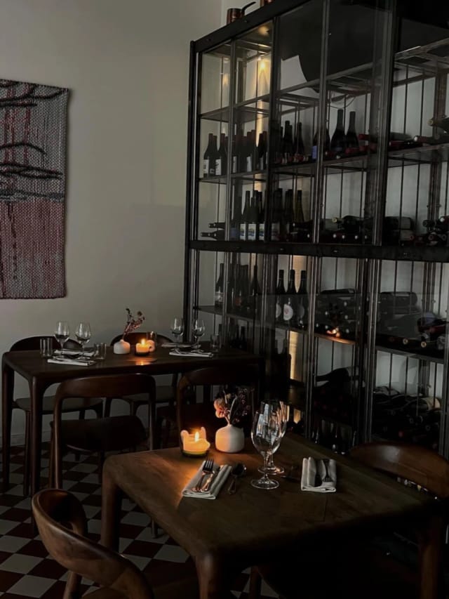 Intimate restaurant table setup with cozy lighting for private events and wine tastings.
