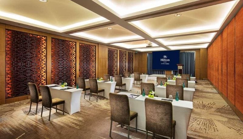 Meeting room at Shangri-La Hotel Beijing with elegant tables, perfect for corporate events.
