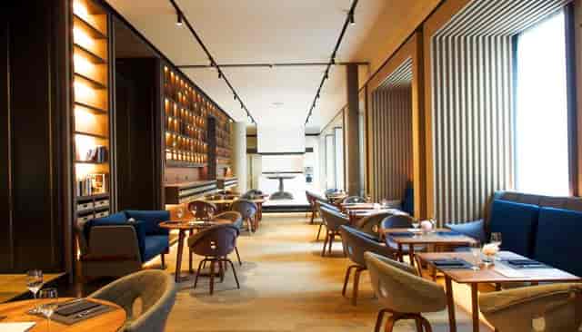 Elegant dining space for private corporate events with inviting warm lighting.