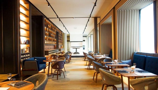 Elegant dining space for private corporate events with inviting warm lighting.