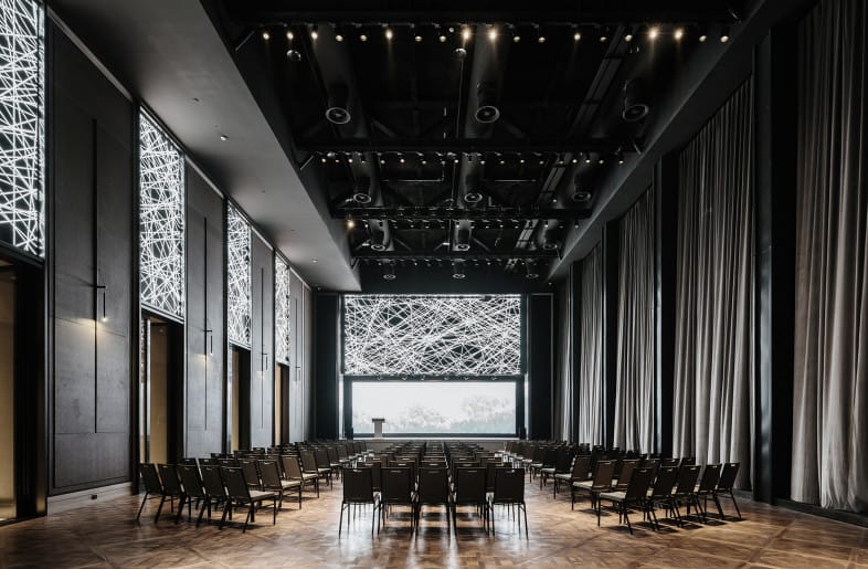 Modern conference space in CHAO with sleek design, ideal for seminars and corporate events.