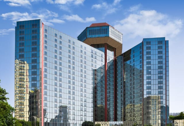 Modern glass façade of The Great Wall Hotel Beijing, perfect for events and meetings.